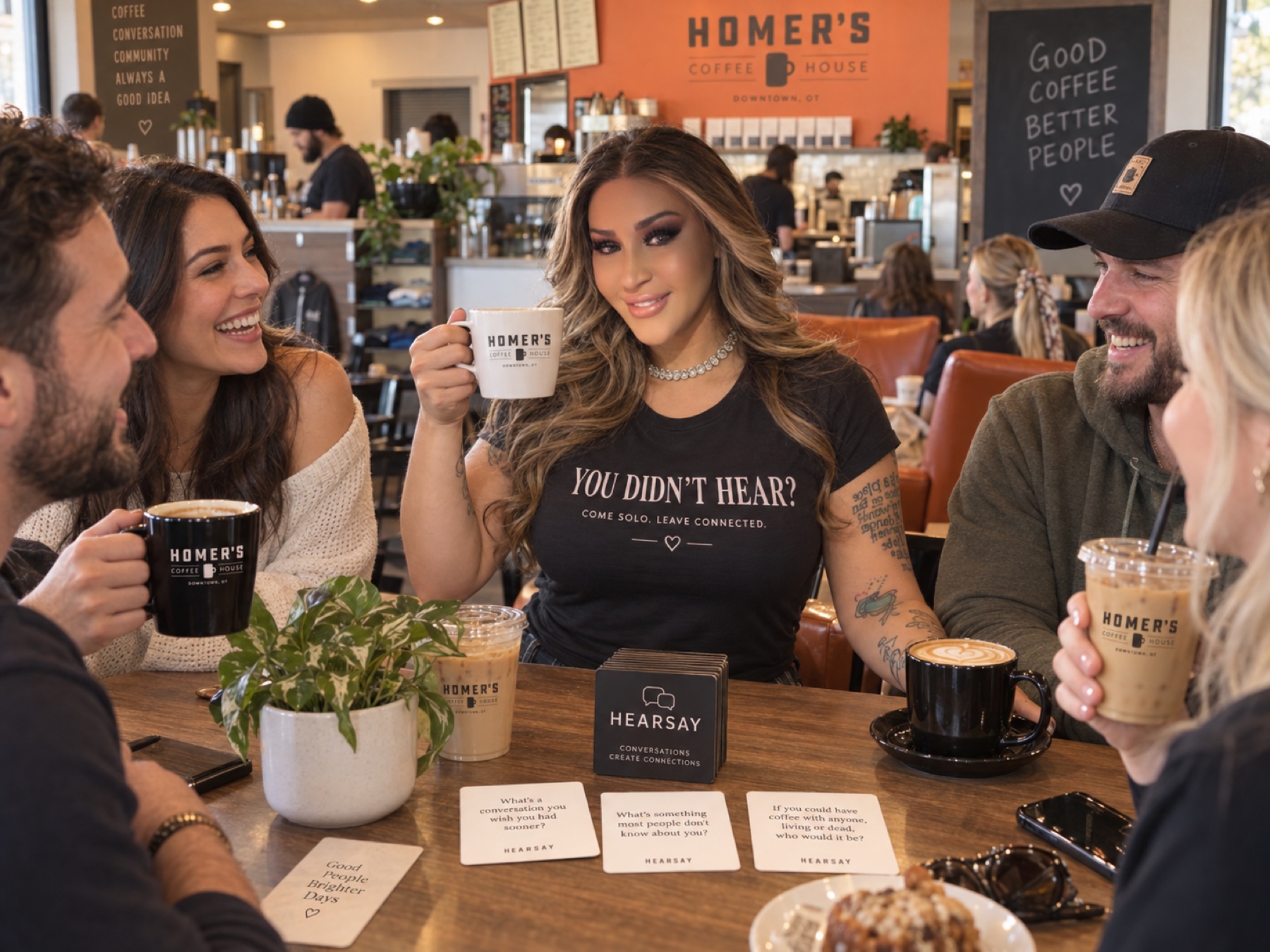 A friendly group connecting over coffee at Homer's Coffee House